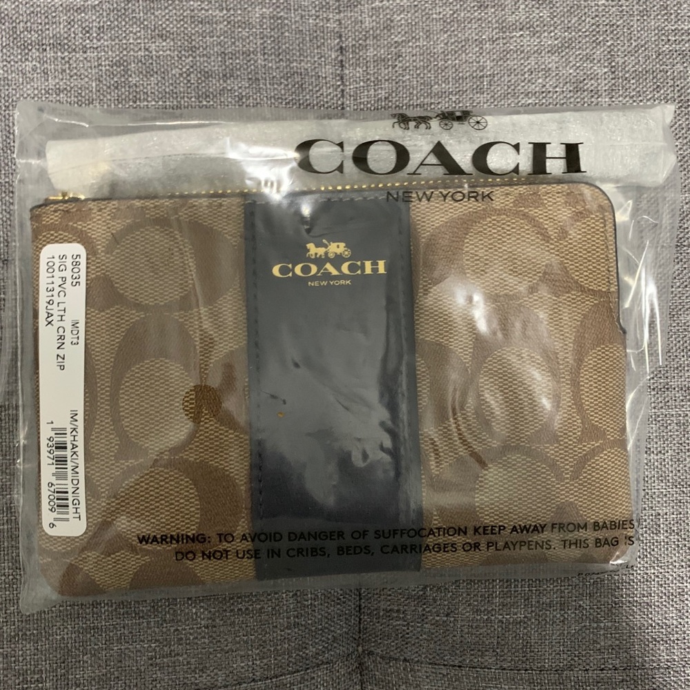 Coach Corner Zip Wristlet In Signature Canvas